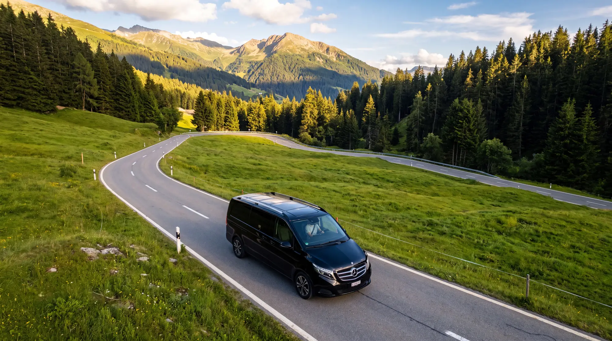 Van taksówka Mercedes na zielonej górskiej drodze w Crans-Montana latem